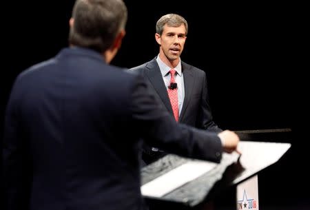 Rep. Beto O'Rourke (D-TX) listens as Sen. Ted Cruz (R-TX) makes a statement during their first debate for Texas U.S. Senate seat at the Southern Methodist University in Dallas, Texas, U.S., September 21, 2018. Tom Fox/The Dallas Morning News/Pool via REUTERS