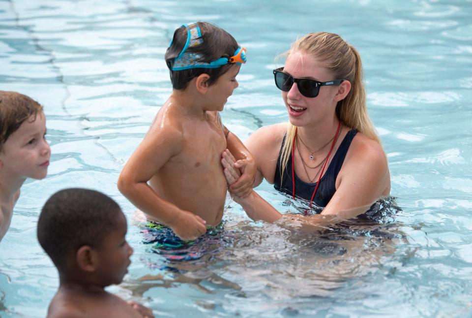 Lifeguard Catelyn Witte, 16, helps Cole Watson, 4, during a swimming lesson at the Rochelle-Landers Neighborhood Pool in Evansville, Ind., Tuesday morning, June 14, 2022.