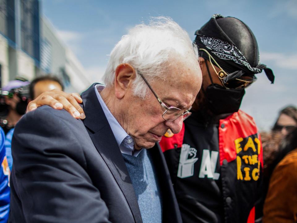 US Senator Bernie Sanders (I-VT) walks next to Amazon Labor Union leader Christian Smalls (R) during a rally outside the company building in Staten Island, New York City, on April 24, 2022. - A recent push for worker unionization has gained traction and found some major successes in the United States. (Photo by Kena Betancur / AFP) (Photo by KENA BETANCUR/AFP via Getty Images)