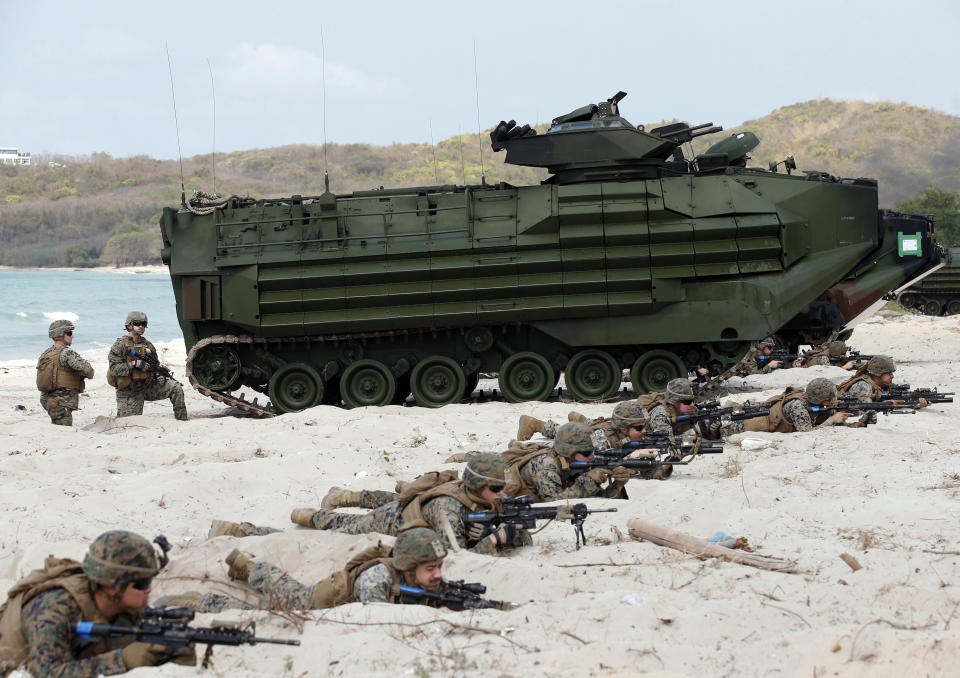 FILE - In this Feb. 16, 2019, file photo, U.S. soldiers land with an amphibious assault vehicle and secure the beach head during the ongoing U.S.-Thai joint military exercise titled "Cobra Gold" on Hat Yao beach in Chonburi province, eastern Thailand. Thailand and the United States kicked off the annual Cobra Gold military exercise, the biggest activity of its type in the Asia-Pacific region with 29 nations taking part as participants or observers, including China. (AP Photo/Sakchai Lalit, File)