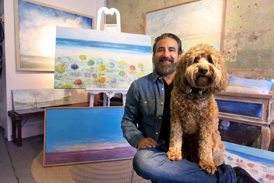 Jim Inzero sits with his dog Tulip inside his Contemporary Encaustic Painting art gallery on Bay Avenue in Point Pleasant Beach Friday, September 1, 2023. The gallery opened in 2018 by Inzero, an impressionist painter whose medium is beeswax.