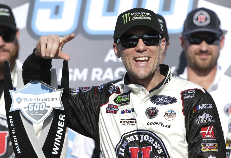 Monster Energy NASCAR Cup Series driver Kevin Harvick (4) celebrates after winning a NASCAR Cup Series auto race on Sunday, March 11, 2018, in Avondale, Ariz. (AP Photo/Rick Scuteri)