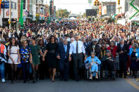 <p>“For Presidential trips, I usually have another White House photographer accompany me so he or she can preset with the press and obtain angles that I can’t, as I usually stay close to the President. Lawrence Jackson made this iconic image from the camera truck as the First Family joined others in beginning the walk across the Edmund Pettus Bridge on March 7, 2015.” (Lawrence Jackson/The White House) </p>
