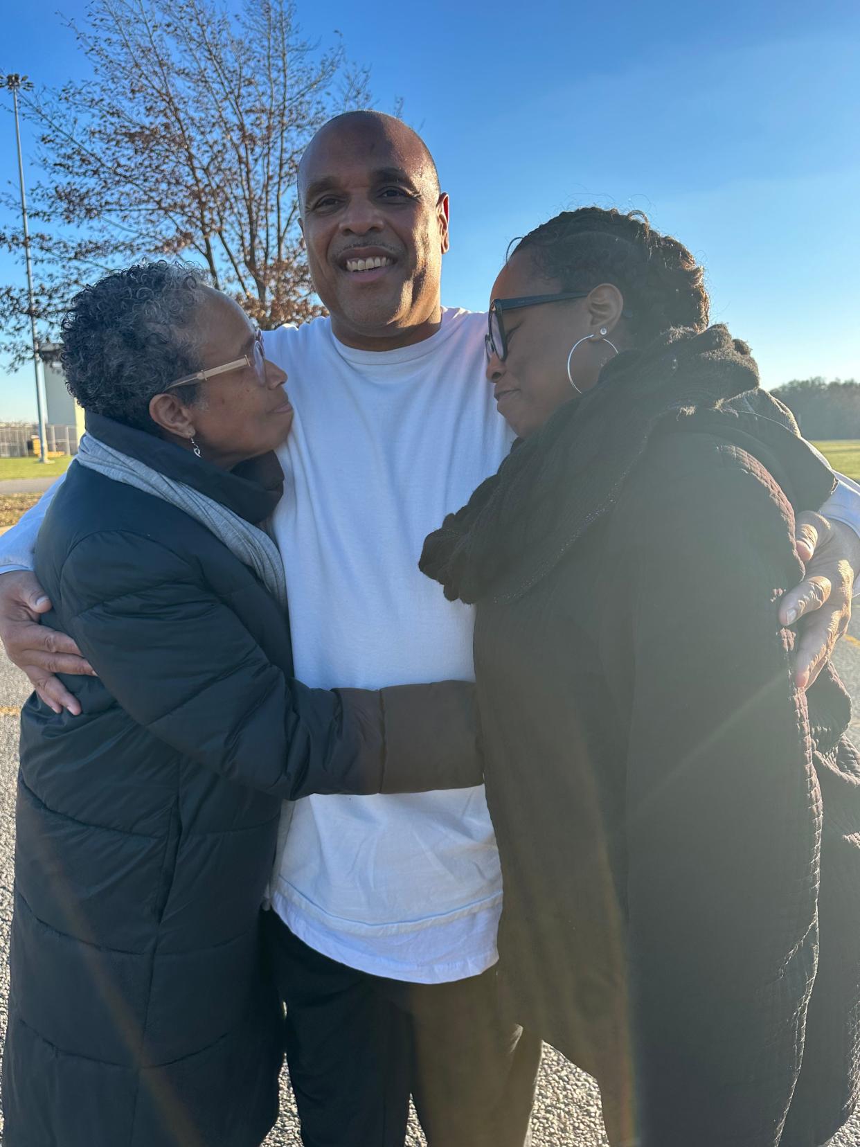 Brian Beals, wrongfully imprisoned for 35 years after being convicted of allegedly killing a 6-year-old in Chicago in 1988, greets his sister Pattilyn and his niece Tamiko Tuesday, Dec. 12, 2023 after he was released from Robinson Correctional Center in Robinson. Beals was exonerated in the case after evidence provided by the Illinois Innocence Project revealed that he was the target of the attack that killed Demetrius Campbell in the Englewood neighborhood on the city's south side.