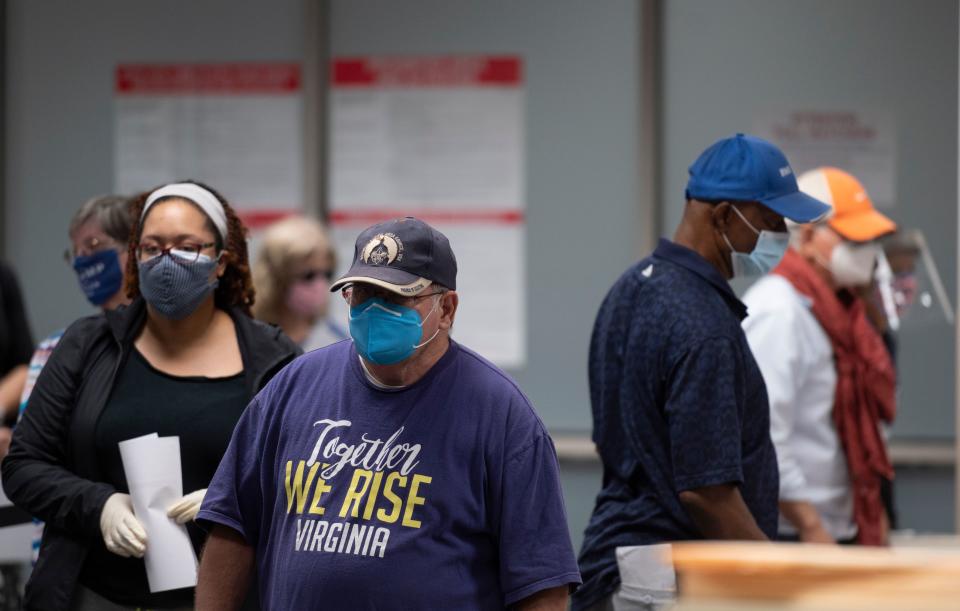 Voters wait in line to cast their ballot at an early voting location in Fairfax, Virginia on September 18, 2020. - Early in-person voting for the 2020 general election kicked off on September 18, 2020 in Virginia (Photo by ANDREW CABALLERO-REYNOLDS / AFP) (Photo by ANDREW CABALLERO-REYNOLDS/AFP via Getty Images)