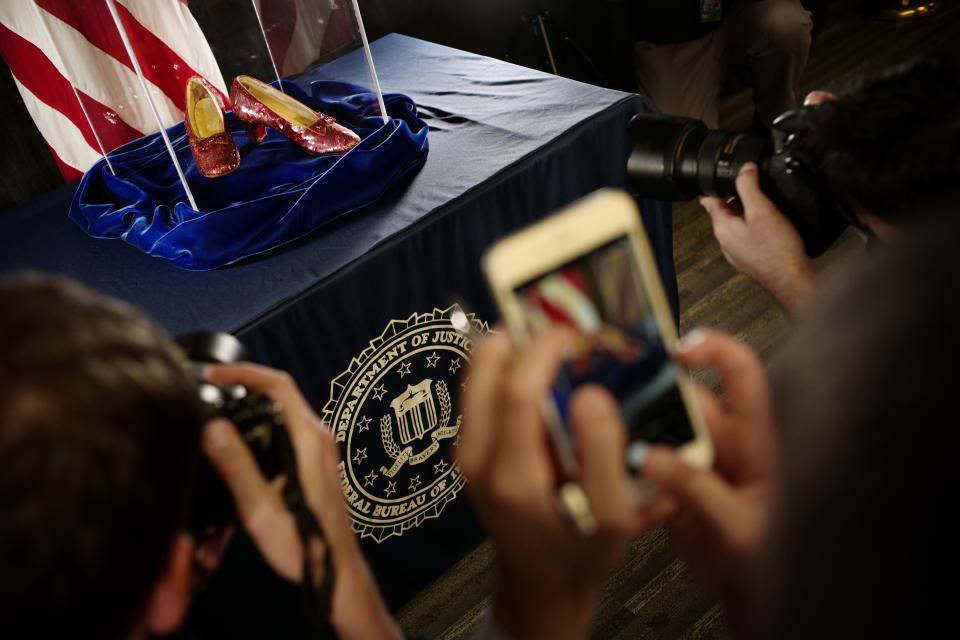 A pair of ruby slippers once worn by actress Judy Garland in the “The Wizard of Oz” are displayed at a news conference Tuesday, Sept. 4, 2018, at the FBI office in Brooklyn Center, Minn. Authorities announced that the slippers, stolen in 2005 from the Judy Garland Museum in Grand Rapids, Minn., were recovered in a sting operation. (Richard Tsong-Taatarii/Star Tribune via AP)