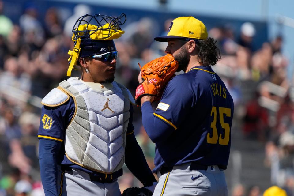 Mar 5, 2024; Scottsdale, Arizona, USA; Milwaukee Brewers catcher Willie Contreras (24) talks to pitcher Jakob Junis (35) in the second inning against the San Francisco Giants at Scottsdale Stadium. Mandatory Credit: Rick Scuteri-USA TODAY Sports