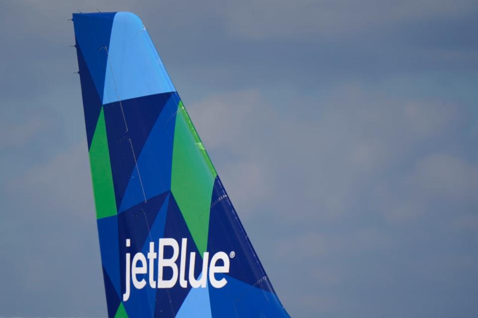 The tail of JetBlue Airbus A321 at Fort Lauderdale airport. A deal with Spirit Airlines was announced on Thursday. (AP)