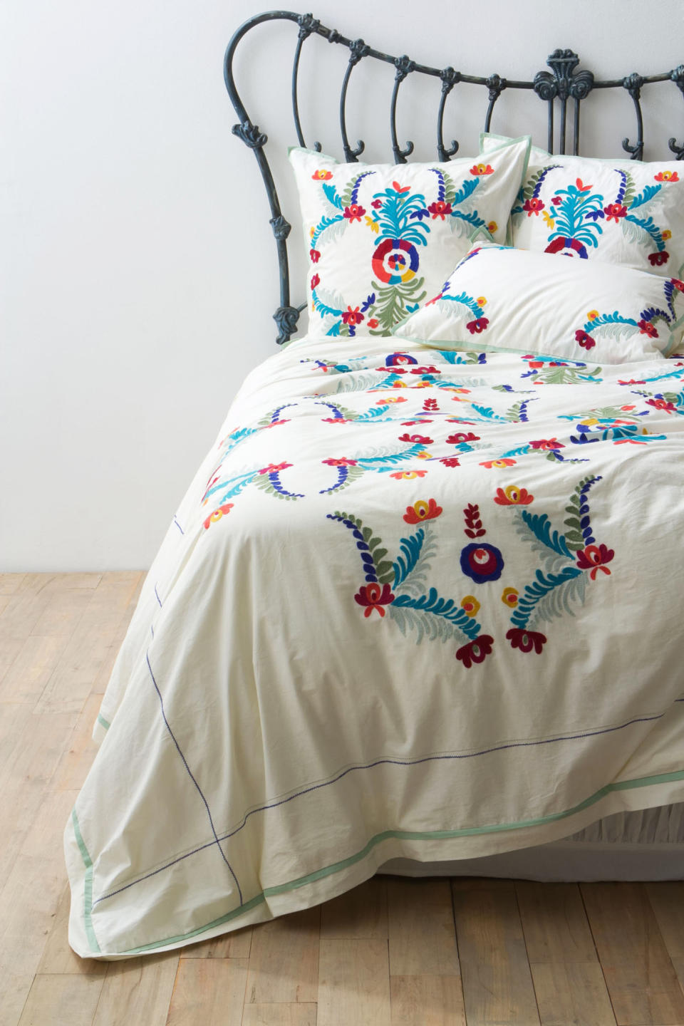 In this undated publicity photo released by Anthropologie.com, an Amora duvet cover features a South American decorative motif that echoes those of Scandinavian country design. The bright colors of the embroidery are appealing, and the white background is typical of Scandesign. (AP Photo/Anthropologie.com)