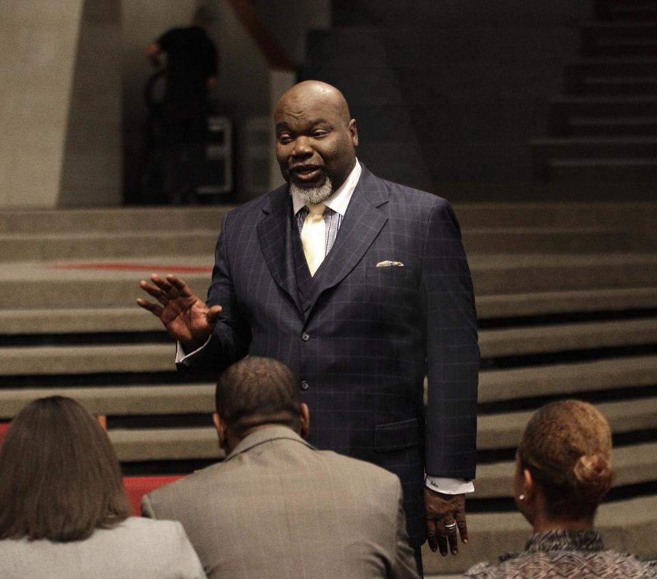 This Aug. 13, 2012 photo shows Bishop T.D. Jakes, foreground, speaking to a group of young adults he mentors at the Potters House in Dallas. Jakes' work as a film producer has motivated him to mentor more young people. As producer for the remake of Sparkle staring Whitney Houston, Jakes and others see Houston's spirit of mentoring and true-to-life role in the film, in which she plays a singer trying to raise her children in the church so they avoid some of the mistakes she made during her career. (AP Photo/LM Otero)