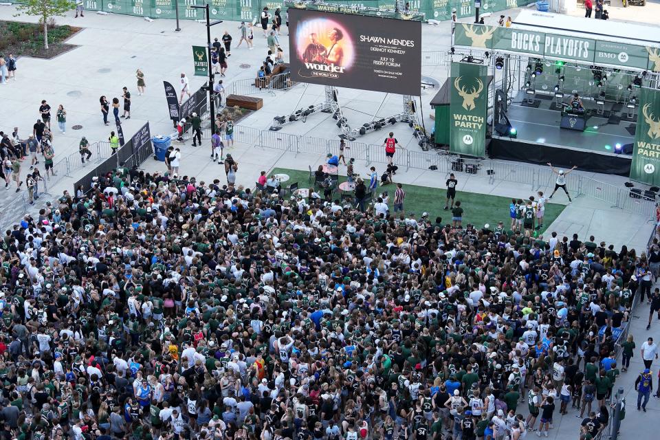 Fans crowd the southern portion of the Deer District plaza before the Milwaukee Bucks' playoff game against the Boston Celtics Friday, May 13, 2022, at Fiserv Forum. A mass shooting erupted in downtown near the entertainment district following that game.