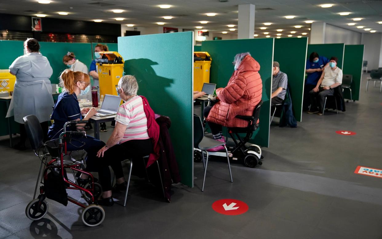 A mass vaccination centre opened in St Helens, Merseyside, one of 10 new ones that opened in England on Monday -  Getty Images Europe