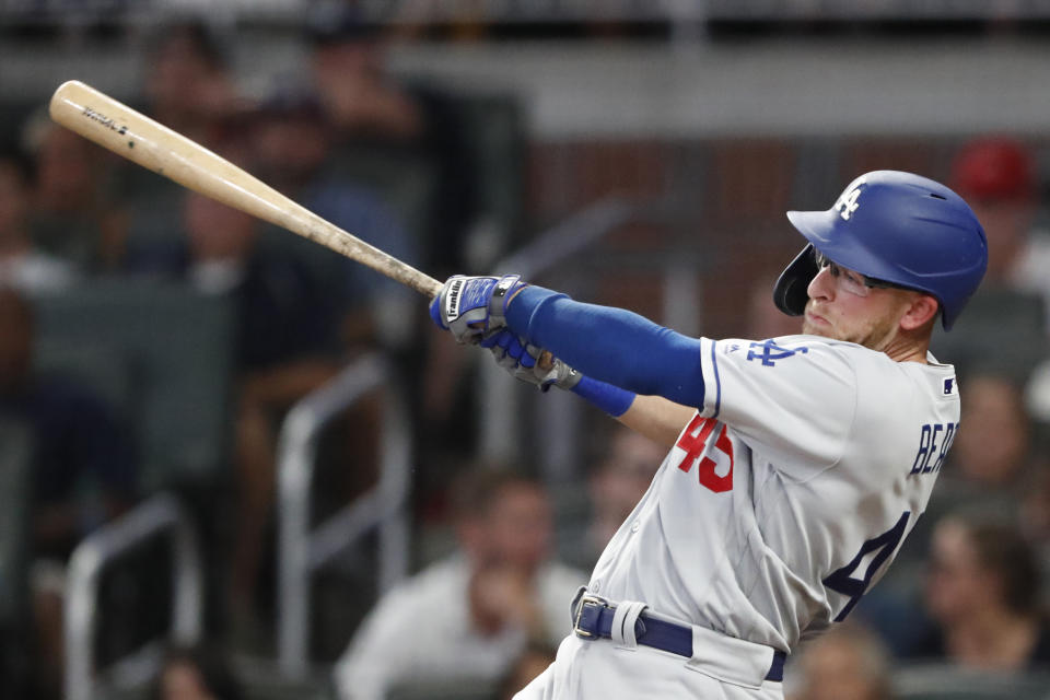 Los Angeles Dodgers' Matt Beaty drives in a run with a base hit in the fifth inning of a baseball game against the Atlanta Braves, Saturday, Aug. 17, 2019, in Atlanta. (AP Photo/John Bazemore)