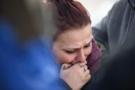 <p>Sierra Kolarik, the sister of Chelsie Cline, one of the victims in a mass shooting at a Pennsylvania car wash early Sunday morning, is comforted on Jan. 28, 2018 in Melcroft, Pa. Five people were found dead and one injured in the shooting. Police were trying to determine if the shooter was among those found at the scene as of Jan. 28, but have since confirmed he died in hospital on Jan. 29. Photo from Justin Merriman/Getty Images. </p>