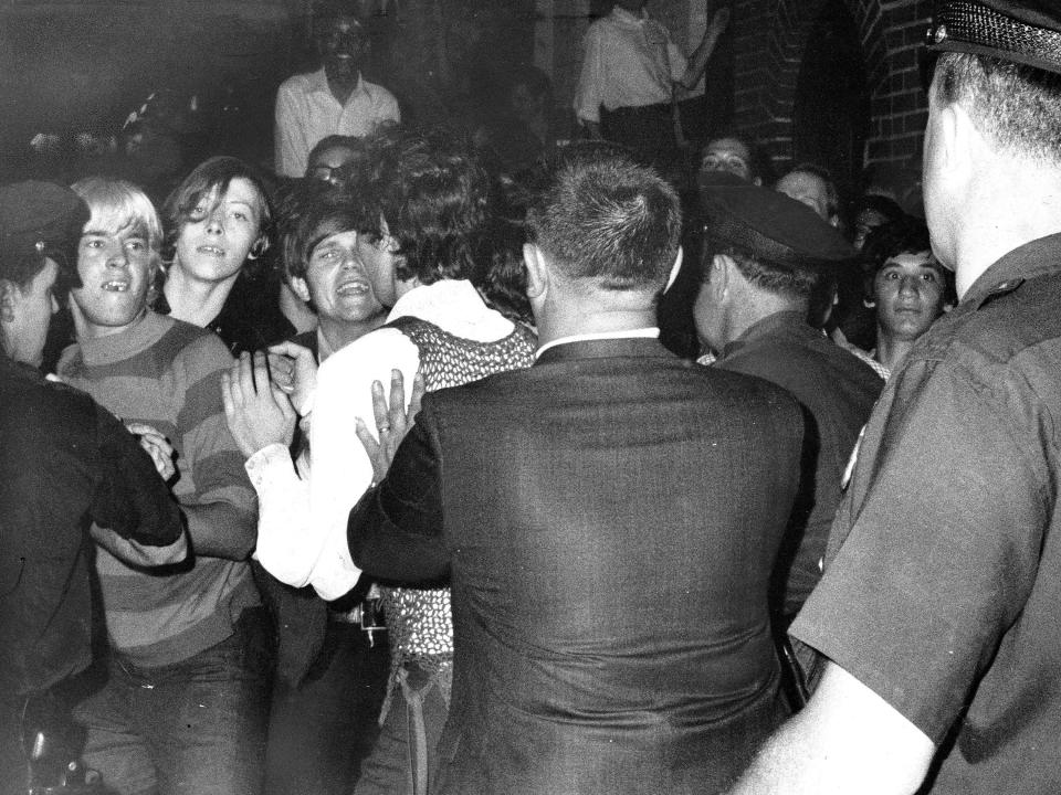 Stonewall Inn nightclub raid. Crowd attempts to impede police arrests outside the Stonewall Inn on Christopher Street in Greenwich Village.