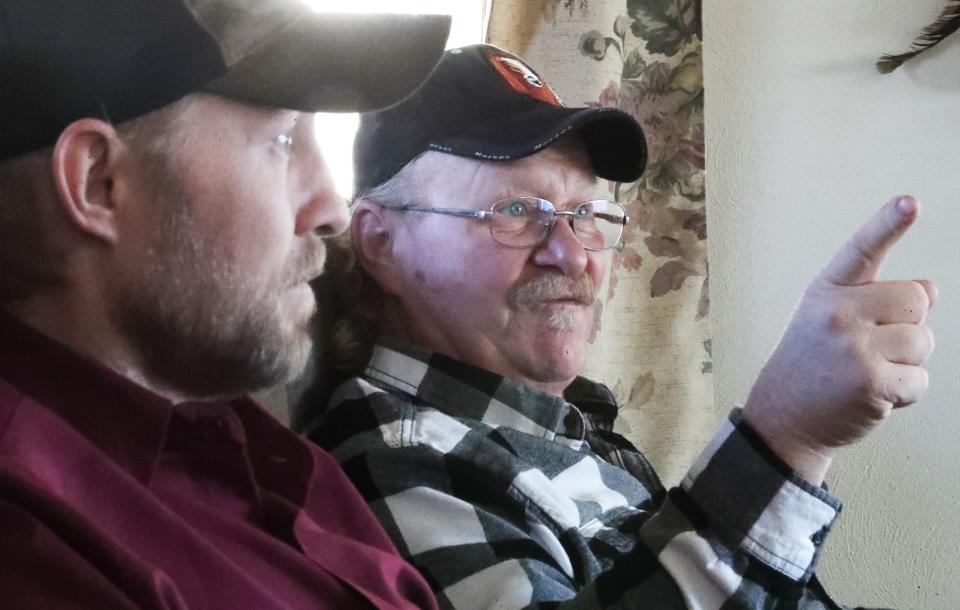 Kip Stackpole, left, listens Monday, March 11, 2024, as his older brother Ricky talks about the importance of paying attention to symptoms of a heart attack. The men suffered heart attacks and were hospitalized at the same time during July 2023.
