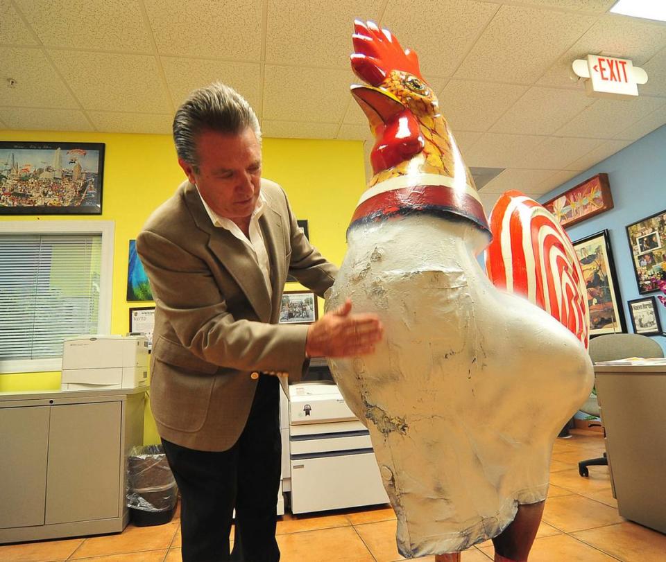 Pablo Canton of the Little Havana Neighborhood Enhancement Team checks the status of the rooster that was stolen in September 2011. The rooster was returned anonymously to his office a week later on Wednesday, Sept. 21, 2011.