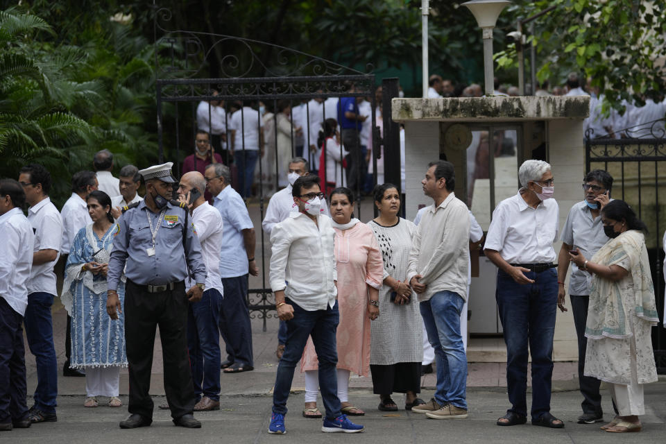 People arrive to homage to veteran stock market investor and Indian billionaire Rakesh Jhunjhunwala at his residence, in Mumbai, India, Sunday, Aug.14, 2022. Jhunjhunwala, nicknamed India’s own Warren Buffett, died Sunday in Mumbai city, Press Trust of India news agency reported. He was 62. (AP Photo/Rafiq Maqbool)