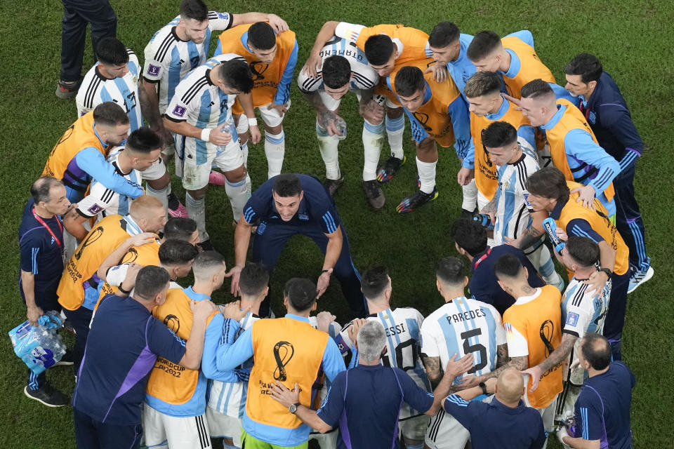 FILE - Argentina's head coach Lionel Scaloni motivates his players in extra time of the World Cup final soccer match between Argentina and France at the Lusail Stadium in Lusail, Qatar, Sunday, Dec. 18, 2022. The penalty shootout is a tense battle of wills over 12 yards (11 meters) that has increasingly become a huge part of soccer and an unavoidable feature of the knockout stage in the biggest competitions. (AP Photo/Thanassis Stavrakis, File)