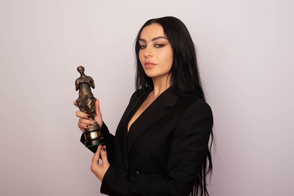 Charli XCX poses with the Visionary Award with Amazon Music, at the Ivor Novello Awards 2023 on May 18, 2023 in London, United Kingdom. (Photo by Dave Hogan/Hogan Media)