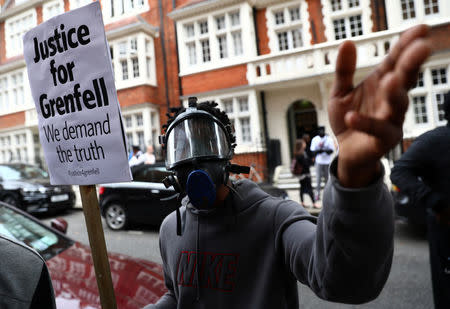 Demonstrators protest against the Grenfell Tower fire outside a Kensington and Chelsea Council meeting at Kensington Town Hall in London, Britain July 19, 2017. REUTERS/Neil Hall