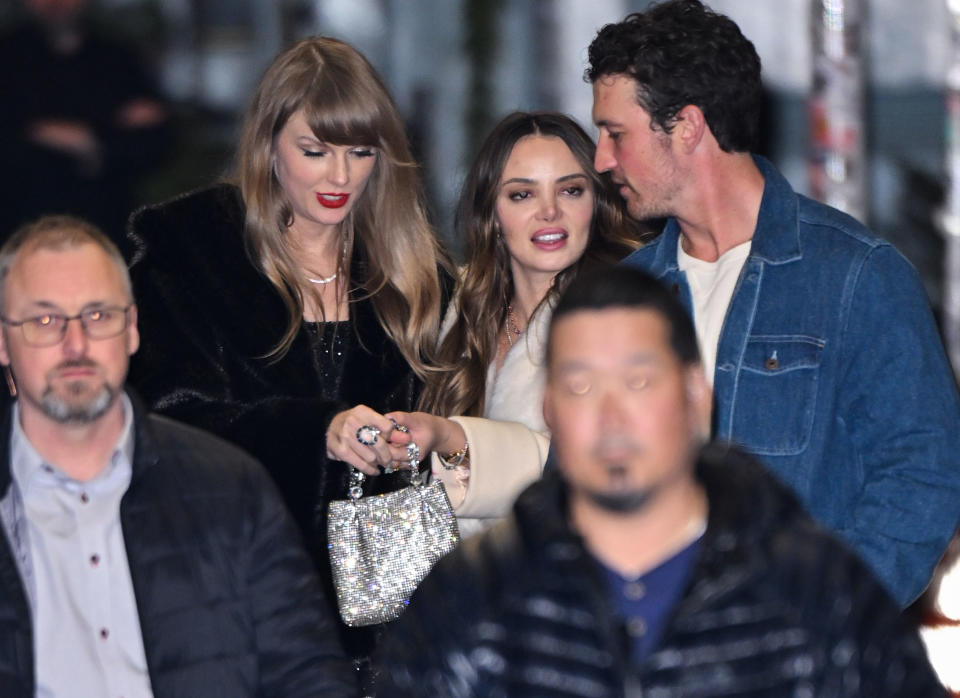 Taylor Swift shows off an allegedly new ring to Keleigh Teller and her husband, Miles.