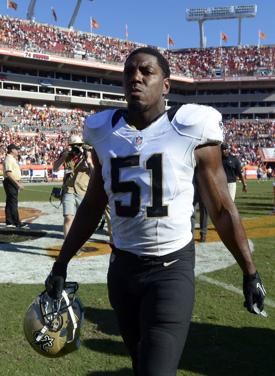 New Orleans Saints linebacker Jonathan Vilma (51) leaves the field after this team defeated the Tampa Bay Buccaneers 35-28 in an NFL football game on Sunday, Oct. 21, 2012, in Tampa, Fla. (AP Photo/ Phelan Ebenhack)