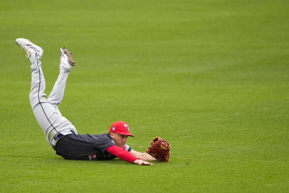 FILE - Cleveland Guardians center fielder Myles Straw makes a diving catch on a ball hit by San Diego Padres' Jake Cronenworth during the fourth inning of a spring training baseball game Monday, Feb. 26, 2024, in Peoria, Ariz. Straw's elite defense isn't enough anymore for the Guardians. The center fielder accepted an outright assignment to Triple-A Columbus after being waived last week by Cleveland.(AP Photo/Lindsey Wasson, File)