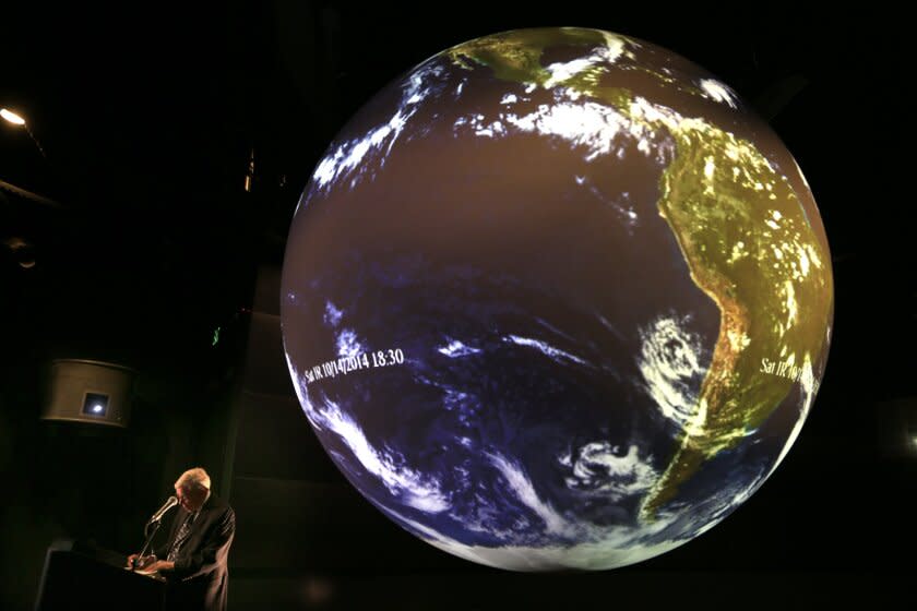 LONG BEACH,CA, NOVEMBER 13, 2014: Aquarium Of The Pacific President Dr. Jerry Schubel gathers his notes prior to a discussion on the El Nino weather phenomenon at the Aquarium Of The Pacific in Long Beach, while projecting images of the weather patterns on their Science On A Sphere in the Ocean Science Center trying to explain what is happening with El Nino, La Nina and what the chances are for a wet Winter November 13, 2014 (Mark Boster/Los Angeles Times).