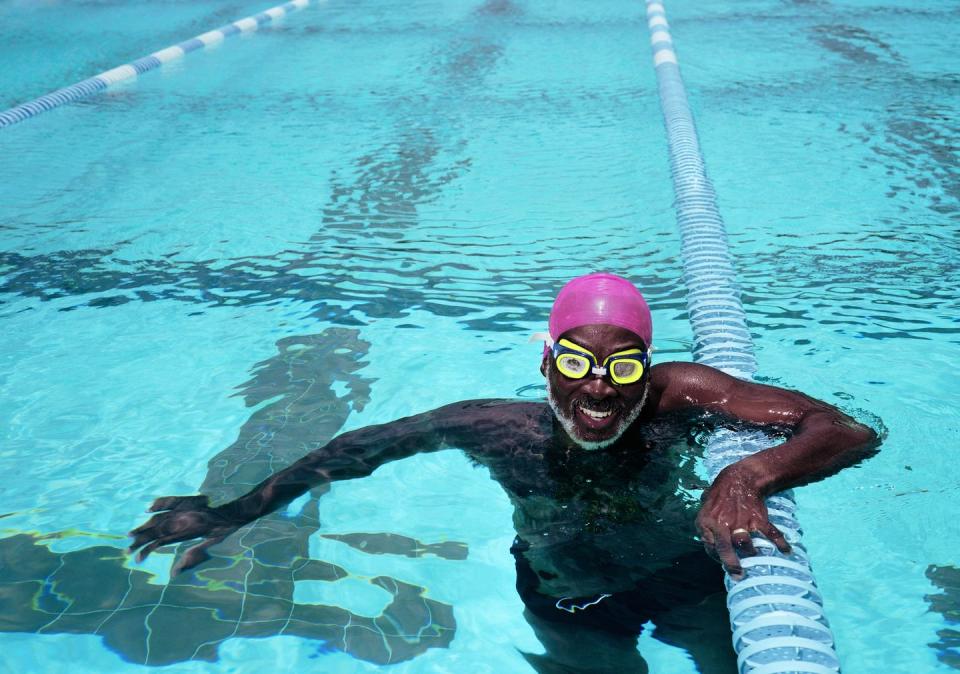 mature man in swimming pool, smiling, portrait