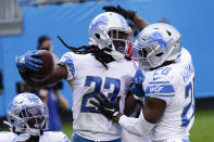 Detroit Lions cornerback Desmond Trufant celebrates with strong safety Duron Harmon, right, after an interception in the end zone during the second half of an NFL football game against the Carolina Panthers Sunday, Nov. 22, 2020, in Charlotte, N.C. (AP Photo/Gerry Broome)