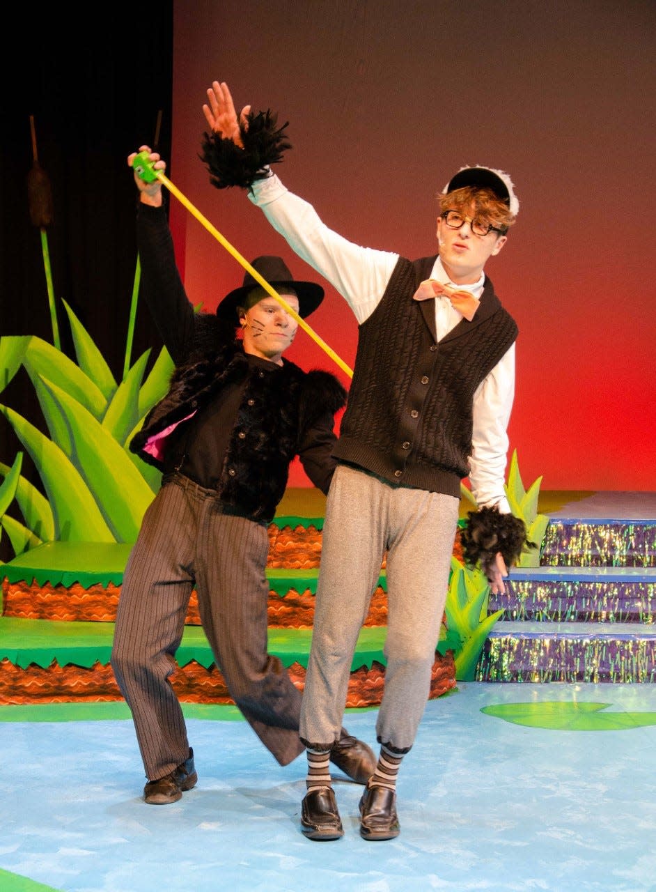 Zachary Kinser, left, as Cat, and Robbie Ritchie, as Ugly,  perform "Play With Your Food," which deals with Cat's plans to make a meal of Ugly, during a rehearsal of Carnation City Players' upcoming "Honk Jr."