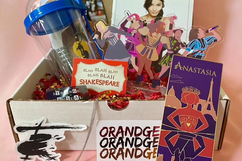 box with broadway-inspired stickers, prints and cup