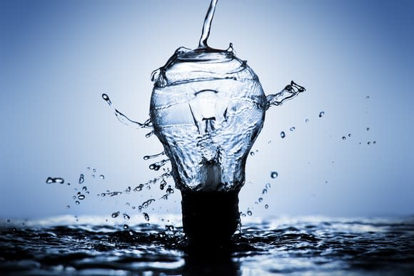 Water pouring over a light bulb