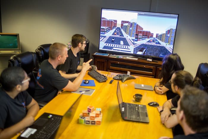 A driverless tech team in a meeting.