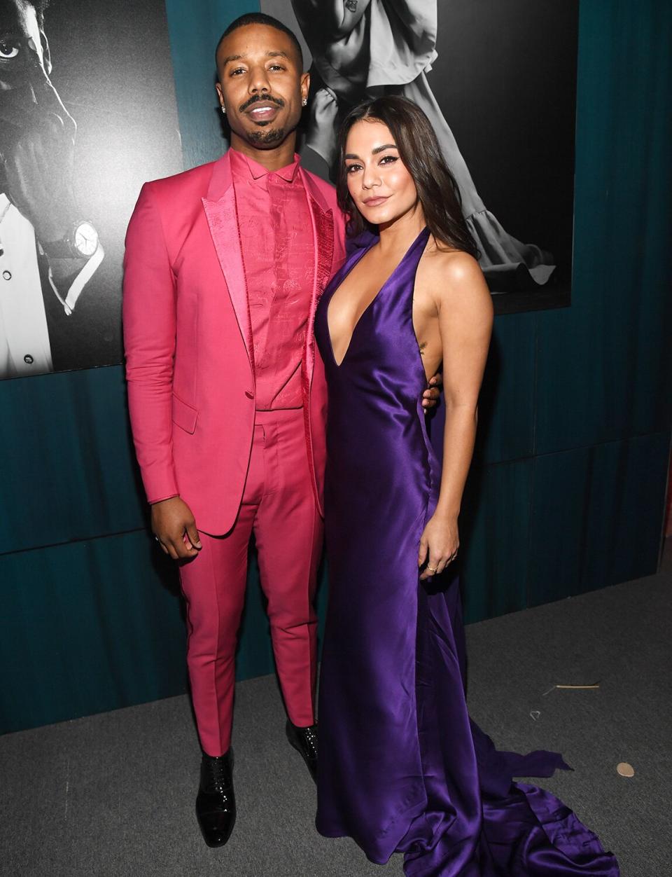 Michael B. Jordan and Vanessa Hudgens bring a pop of color to the Vanity Fair Oscar Party in their hot pink and purple ensembles. 