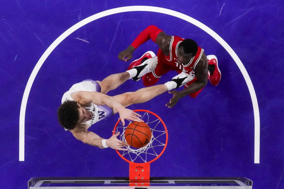 Washington center Braxton Meah, left, dunks in front of Utah center Keba Keita during the first half of an NCAA college basketball game Saturday, Jan. 27, 2024, in Seattle. Washington won 98-73. | Lindsey Wasson, Associated Press