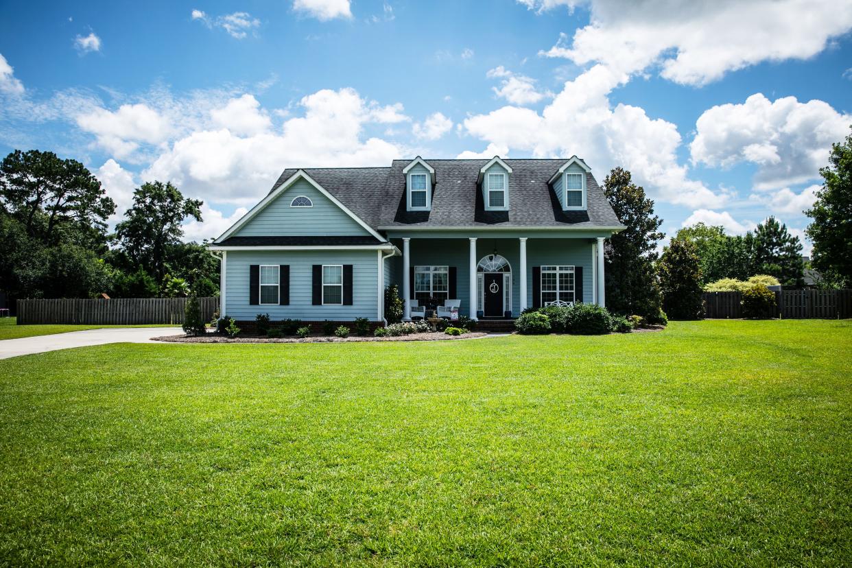 suburban house with a large yard