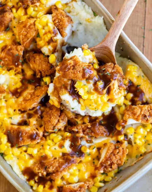 <p>The Cozy Cook</p><p>This mouth-watering mashed potato casserole is loaded with creamy mashed potatoes and topped with crispy chicken tenders, corn, cheddar cheese and a drizzle of brown gravy! </p><p><strong>Get the recipe: <a href="https://thecozycook.com/mashed-potato-casserole/" rel="nofollow noopener" target="_blank" data-ylk="slk:Mashed Potato Casserole with Crispy Chicken;elm:context_link;itc:0;sec:content-canvas" class="link ">Mashed Potato Casserole with Crispy Chicken</a></strong></p>