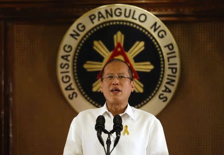 Philippine President Benigno Aquino addresses the nation in a live broadcast at the presidential Malacanang Palace in Manila, July 14, 2014. REUTERS/Erik De Castro