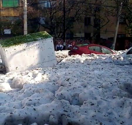 Street covered in ice is pictured after a heavy storm of rain and hail in Guadalajara