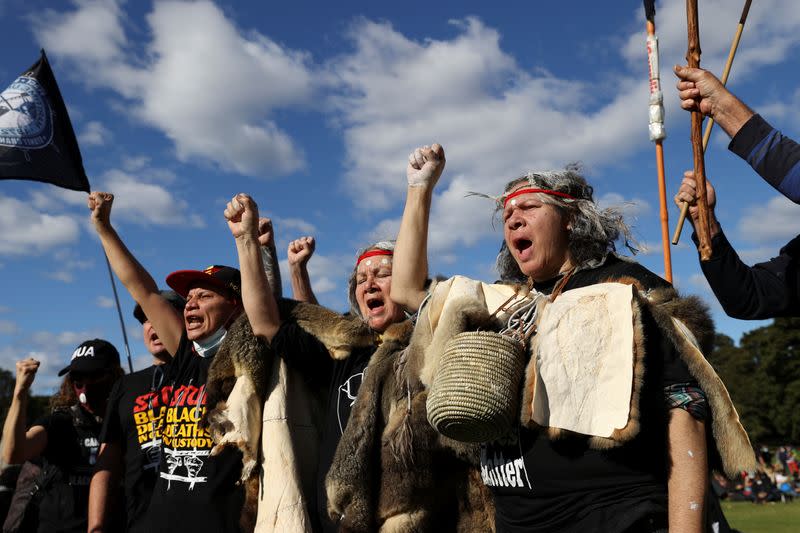 People demonstrate in solidarity with the Black Lives Matter (BLM) rallies in the United States, calling for an end to police brutality against Black people in the United States and First Nations people in Australia, in Sydney