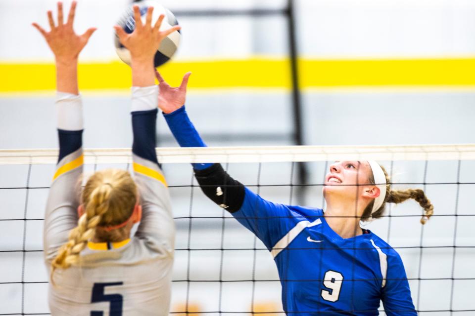 West Liberty's Macy Daufeldt (9) attempts a kill during a Class 3A varsity volleyball game.