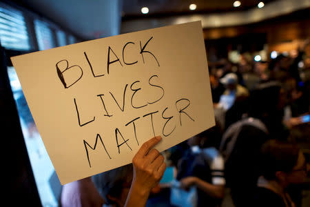 Interfaith clergy leaders stage a sit-in at the Center City Starbucks, where two black men were arrested, in Philadelphia, Pennsylvania U.S. April 16, 2018. REUTERS/Mark Makela