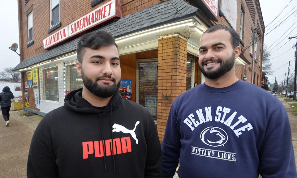 Murtada Alsaad, 19, left, is the general manager of Almadina Supermarket, 2325 Parade St. He is shown with his uncle, store owner Muhhamed Alnasari, 34.