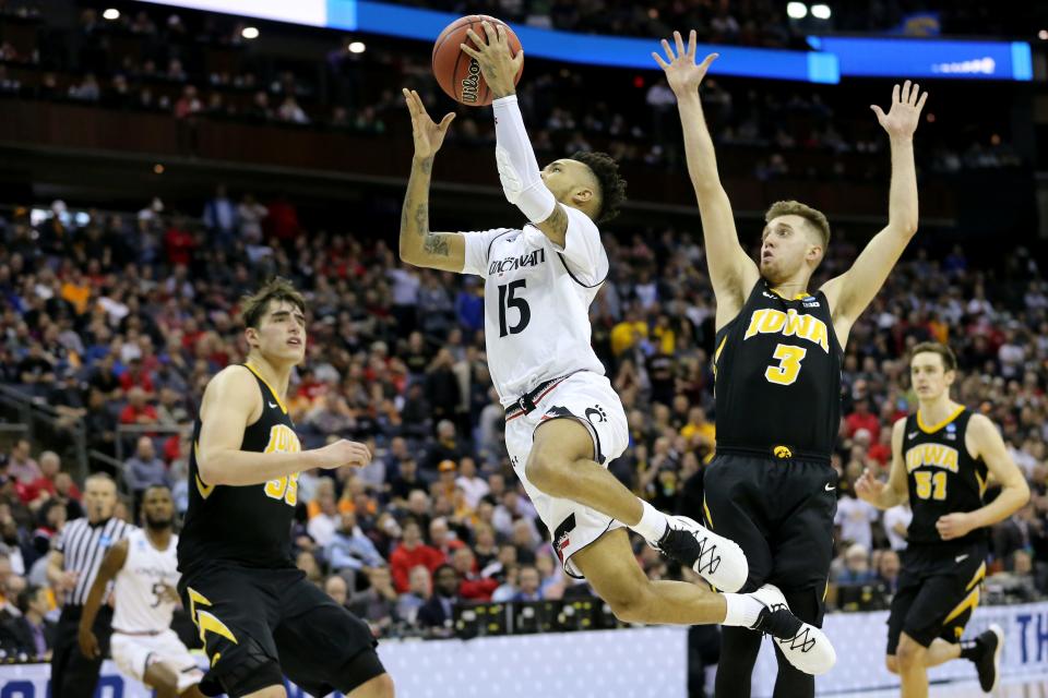 Cincinnati Bearcats guard Cane Broome (15) takes it to the basket as Iowa Hawkeyes guard Jordan Bohannon (3) defends in the second half of the NCAA Tournament Round of 64 game, Friday, March 22, 2019, at Nationwide Arena in Columbus, Ohio. Cincinnati Bearcats lost to the Iowa Hawkeyes 79-72. 