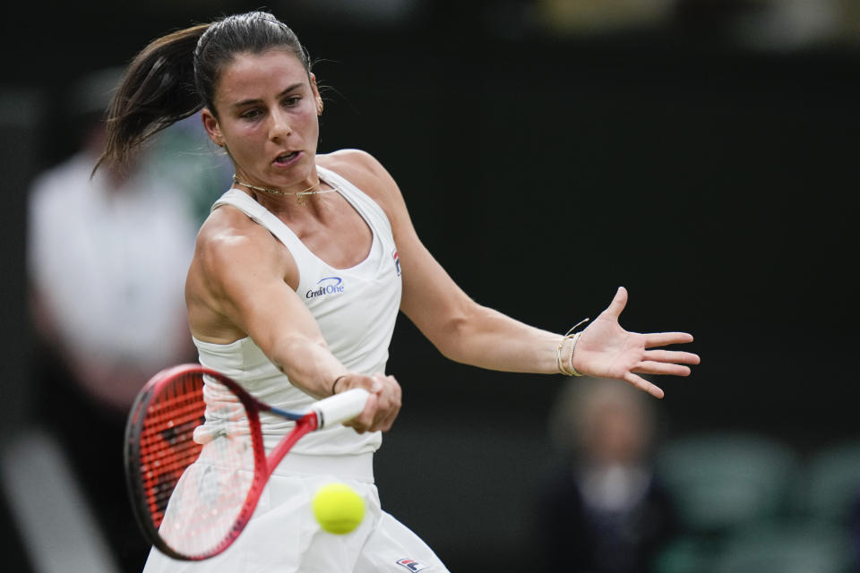 Emma Navarro of the United States plays a forehand return to compatriot Coco Gauff during their fourth round match at the Wimbledon tennis championships in London, Sunday, July 7, 2024. (AP Photo/Alberto Pezzali)