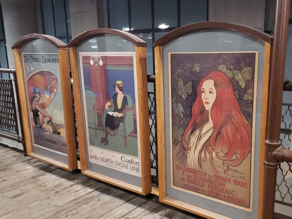 vintage posters on the platform of the quincy L stop in chicago