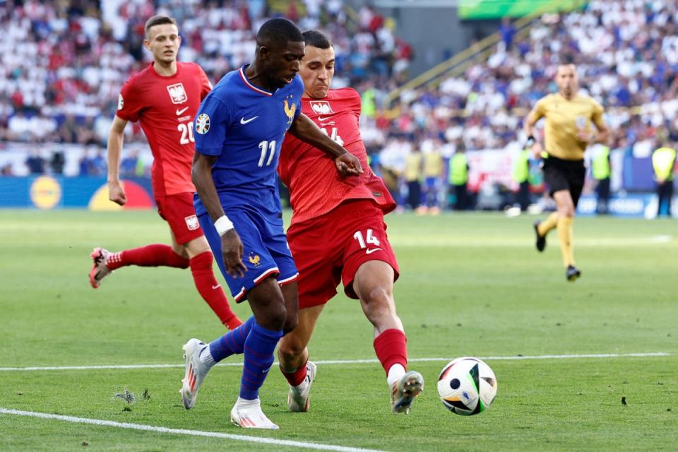 Jakub Kiwior takes out Ousmane Dembele affording France a penalty. (AFP via Getty Images)