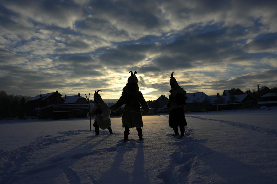 Revelers take part in a traditional St Nicholas procession in the village of Lidecko, Czech Republic, Monday, Dec. 4, 2023. This pre-Christmas tradition has survived for centuries in a few villages in the eastern part of the country. (AP Photo/Petr David Josek)